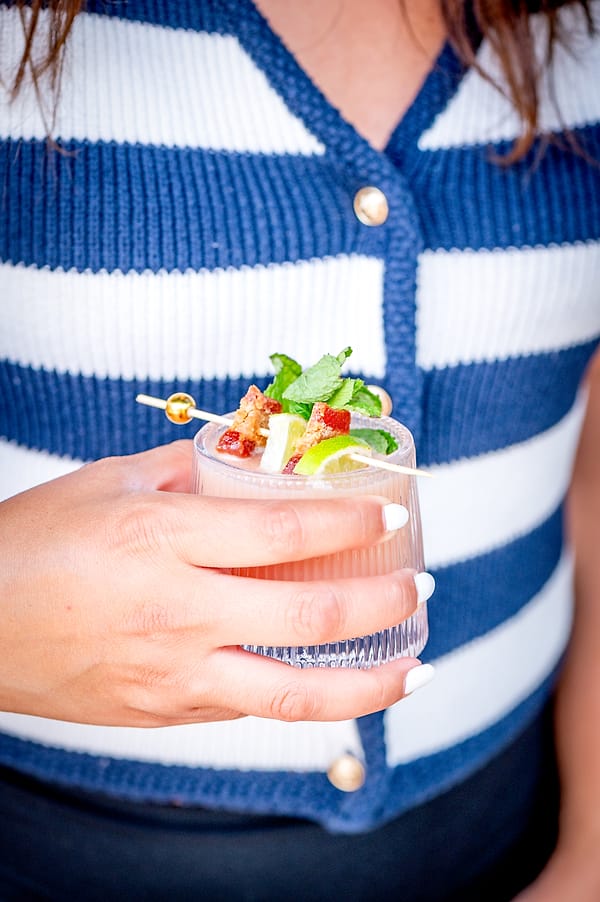 Coco loco cocktail held in hand