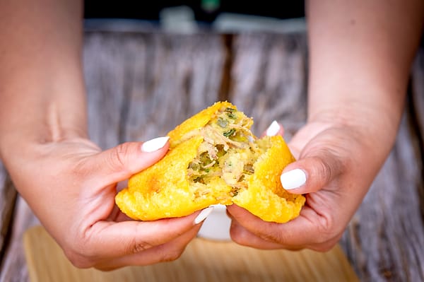Empanada broken open by hand