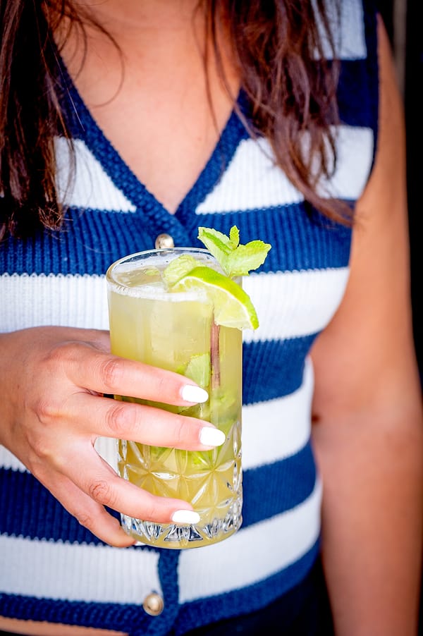 Mint mojito held in hand